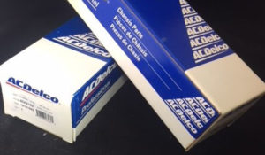 Two blue and white boxes of AC Delco Chassis Parts